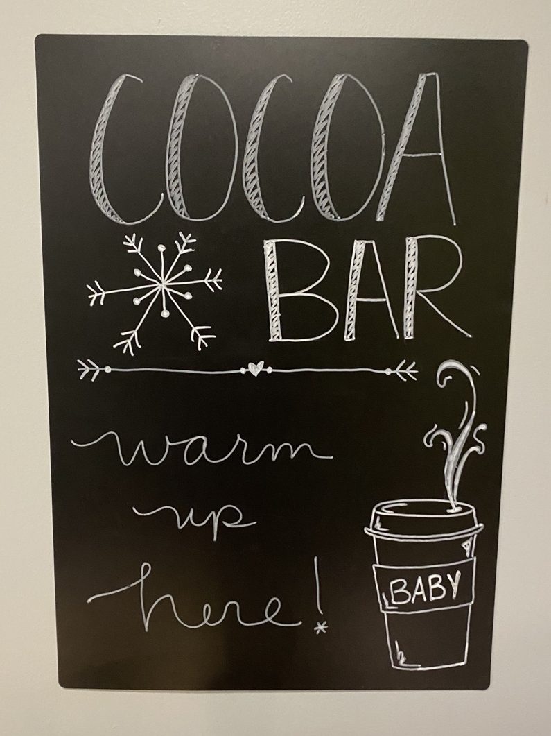 Winter Wonderland Baby Shower Hot Cocoa Bar Decor | mamasbrush designs
Blue and white party decor, chalkboard art, cocoa bar chalkboard, Winter baby shower, winter dessert table